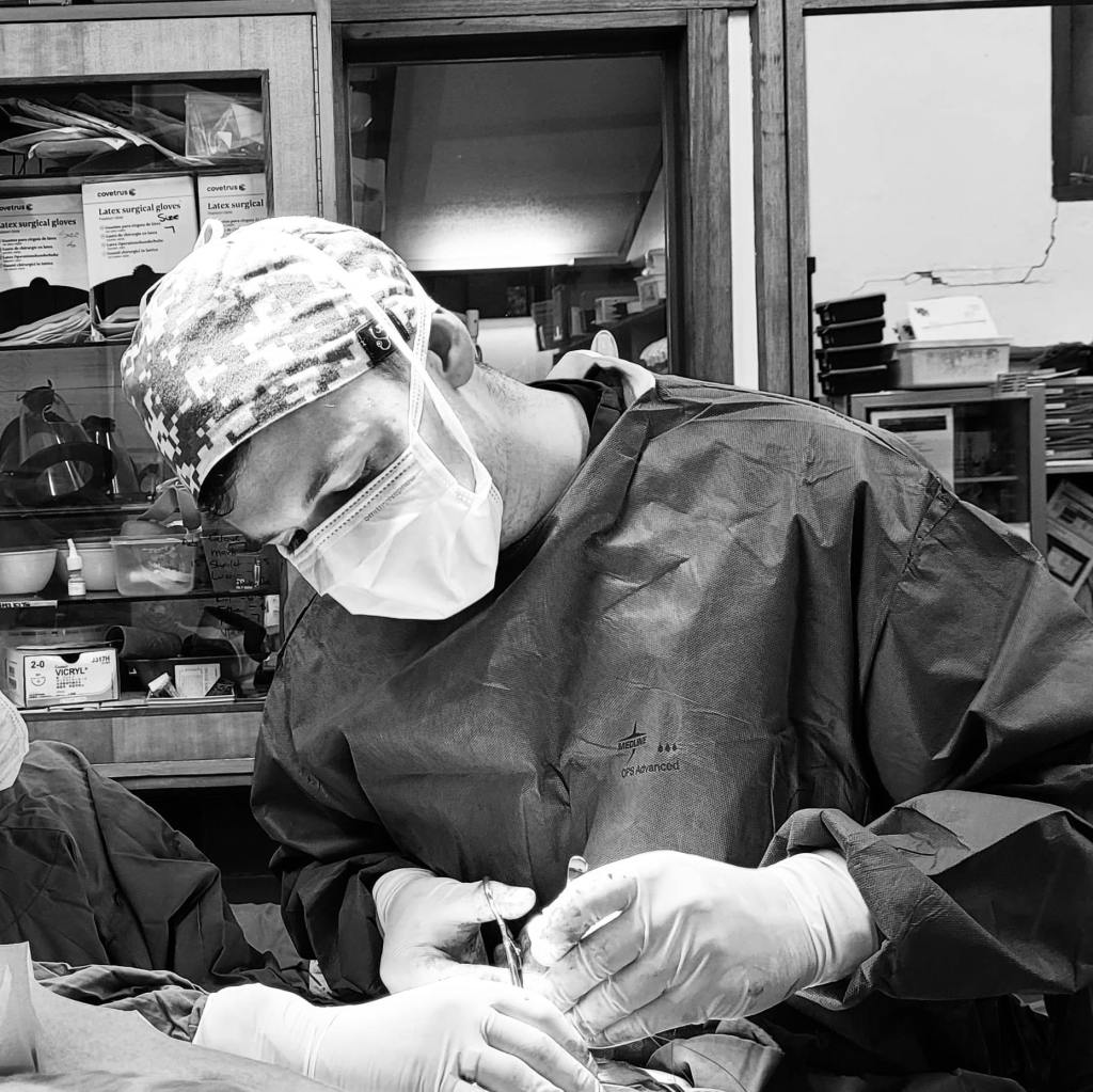Dr. Ethan Romas-Hill, Veterinarian performing orthopaedic surgery